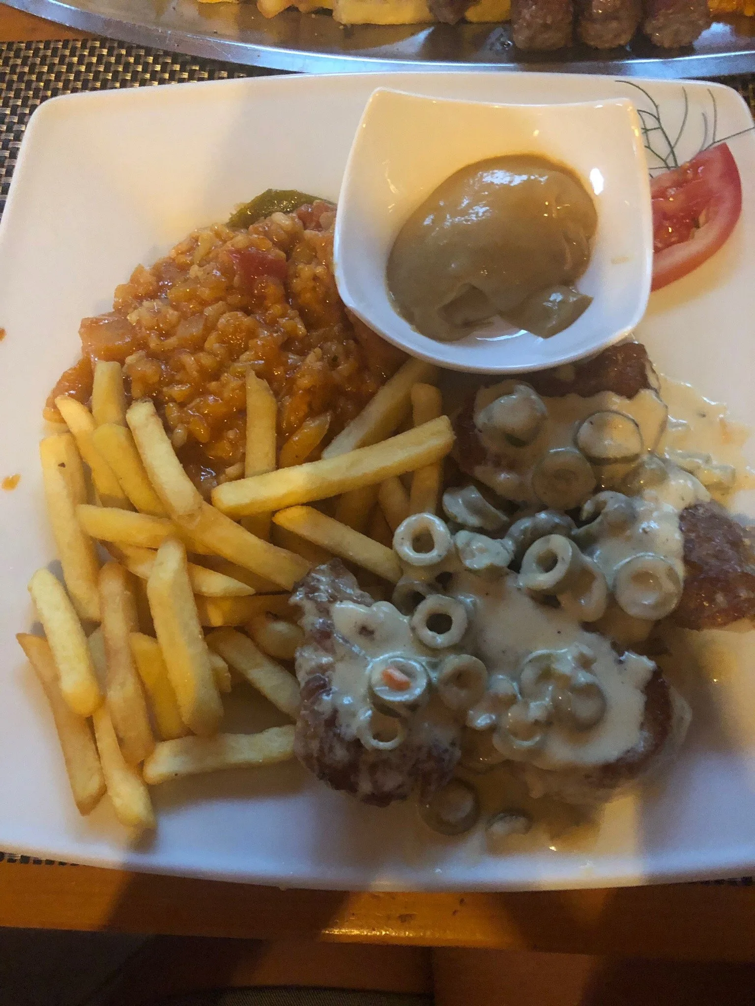 Mixed grill with fries and mushroom sauce