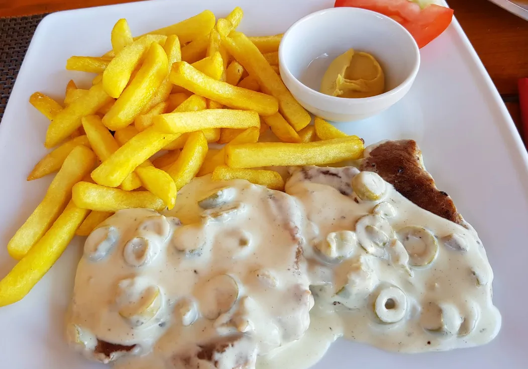 Turkey steak in cheese sauce